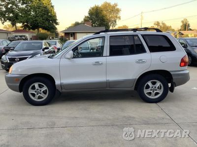 Czwarte zdjęcie samochodu z boku: 2002 HYUNDAI SANTA FE GLS VIN:KM8SC73D12U150049 - miniatura