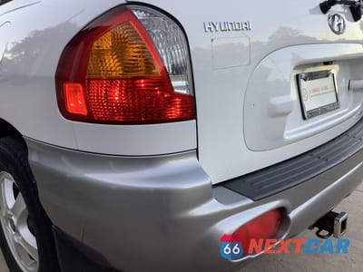 Zdjęcie 12 z 27 samochodu: 2002 HYUNDAI SANTA FE GLS VIN:KM8SC73D12U150049 - miniatura