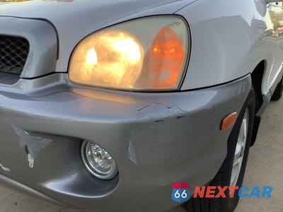 Zdjęcie 11 z 27 samochodu: 2002 HYUNDAI SANTA FE GLS VIN:KM8SC73D12U150049 - miniatura