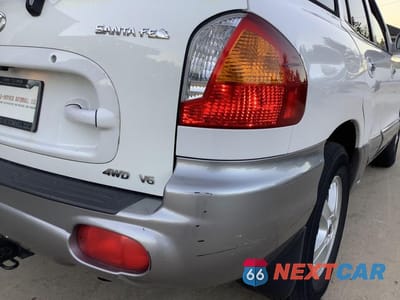 Zdjęcie 13 z 27 samochodu: 2002 HYUNDAI SANTA FE GLS VIN:KM8SC73D12U150049 - miniatura