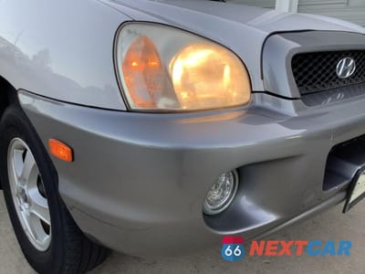 Zdjęcie 10 z 27 samochodu: 2002 HYUNDAI SANTA FE GLS VIN:KM8SC73D12U150049 - miniatura