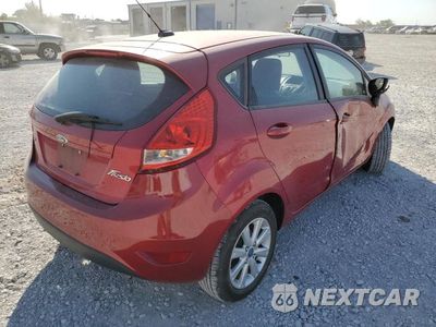 Czwarte zdjęcie samochodu z boku: 2011 FORD FIESTA SE VIN:3FADP4EJ9BM216201 - miniatura