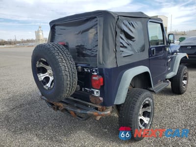 Czwarte zdjęcie samochodu z boku: 1997 JEEP WRANGLER / TJ SPORT VIN:1J4FY19S0VP486637 - miniatura