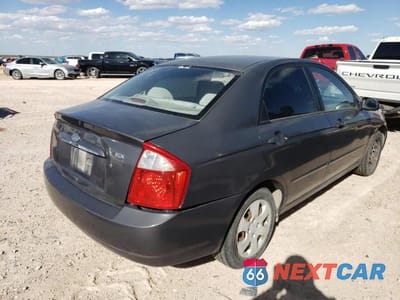 Czwarte zdjęcie samochodu z boku: 2004 KIA SPECTRA LX VIN:KNAFE122145052033 - miniatura