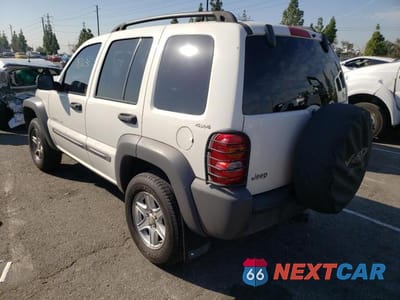 Trzecie zdjęcie samochodu z tyłu: 2002 JEEP LIBERTY SPORT VIN:1J4GL48K72W187153 - miniatura