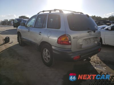 Trzecie zdjęcie samochodu z tyłu: 2002 HYUNDAI SANTA FE GLS VIN:KM8SC13D02U245599 - miniatura