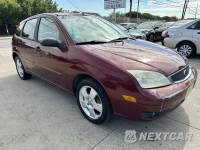 Zdjęcie 11 z 14 samochodu: 2006 FORD FOCUS ZX5 VIN:1FAHP37NX6W160352 - miniatura