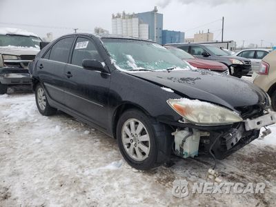 Czwarte zdjęcie samochodu z boku: 2002 TOYOTA CAMRY LE VIN:JTDBF30K420057170 - miniatura