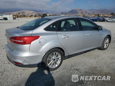 Trzecie zdjęcie samochodu z tyłu: 2016 FORD FOCUS SE VIN:1FADP3F27GL286497 - miniatura