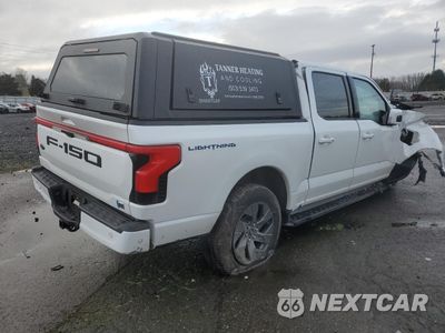 Trzecie zdjęcie samochodu z tyłu: 2023 FORD F150 LIGHTNING PRO VIN:1FTVW1EV6PWG42762 - miniatura