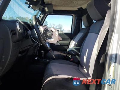 Zdjęcie 7 z 12 samochodu: 2012 JEEP WRANGLER UNLIMITED SAHARA VIN:1C4BJWEG4CL119025 - miniatura