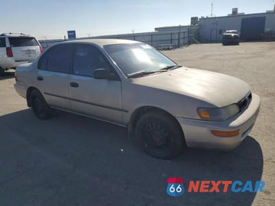 Czwarte zdjęcie samochodu z boku: 1995 TOYOTA COROLLA LE VIN:1NXAE09B2SZ329302 - miniatura
