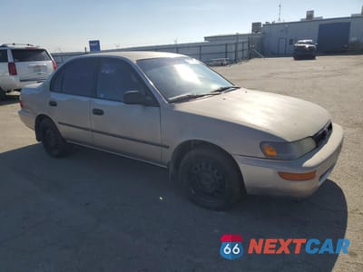 Czwarte zdjęcie samochodu z boku: 1995 TOYOTA COROLLA LE VIN:1NXAE09B2SZ329302 - miniatura