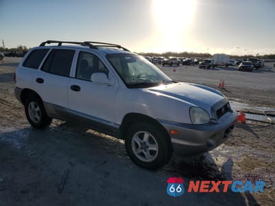 Czwarte zdjęcie samochodu z boku: 2003 HYUNDAI SANTA FE GLS VIN:KM8SC13D73U508611 - miniatura