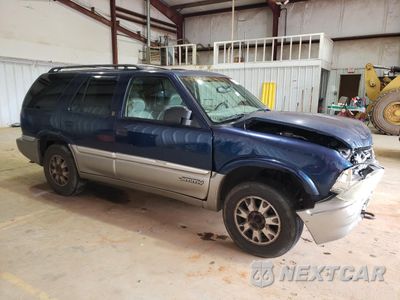 Czwarte zdjęcie samochodu z boku: 1999 GMC JIMMY VIN:1GKDT13WXX2539100 - miniatura