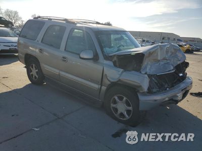 Czwarte zdjęcie samochodu z boku: 2001 CHEVROLET TAHOE C1500 VIN:1GNEC13TX1J236201 - miniatura