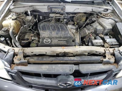 Zdjęcie 12 z 13 samochodu: 2004 MAZDA TRIBUTE VIN:4F2CZ96184KM26214 - miniatura