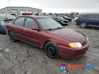 Czwarte zdjęcie samochodu z boku: 2003 KIA SPECTRA BASE VIN:KNAFB121335215523 - miniatura