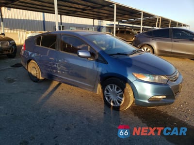 Czwarte zdjęcie samochodu z boku: 2010 HONDA INSIGHT LX VIN:JHMZE2H51AS030763 - miniatura