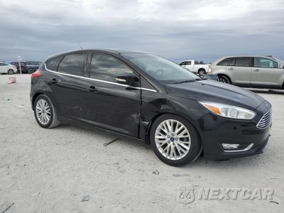 Czwarte zdjęcie samochodu z boku: 2017 FORD FOCUS TITANIUM VIN:1FADP3N28HL214498 - miniatura