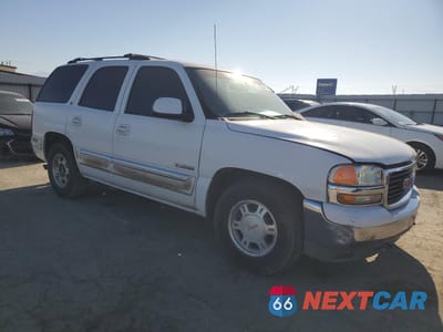 Czwarte zdjęcie samochodu z boku: 2001 GMC YUKON VIN:1GKEC13T81J250465 - miniatura