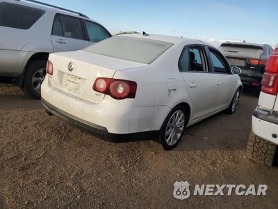Trzecie zdjęcie samochodu z tyłu: 2010 VOLKSWAGEN JETTA WOLFSBURG VIN:3VWRA7AJ7AM116554 - miniatura