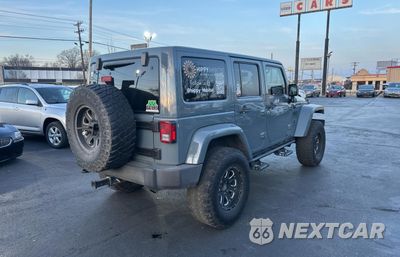 Czwarte zdjęcie samochodu z boku: 2015 JEEP WRANGLER UNLIMITED RUBICON VIN:1C4BJWFG9FL591711 - miniatura