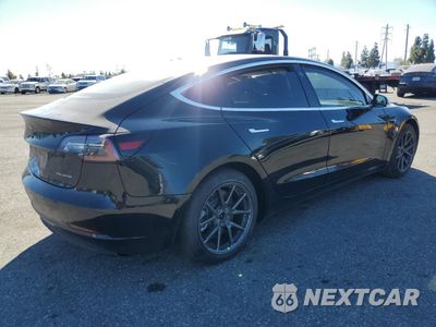 Trzecie zdjęcie samochodu z tyłu: 2018 TESLA MODEL 3 VIN:5YJ3E1EB2JF144229 - miniatura