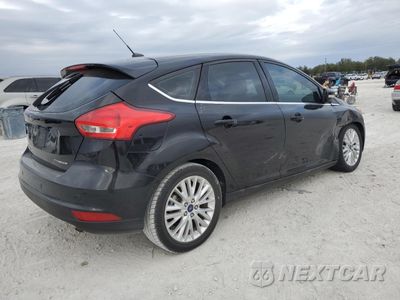 Trzecie zdjęcie samochodu z tyłu: 2017 FORD FOCUS TITANIUM VIN:1FADP3N28HL214498 - miniatura