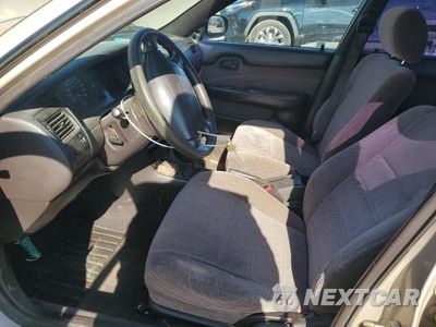 Zdjęcie 7 z 12 samochodu: 1995 TOYOTA COROLLA LE VIN:1NXAE09B2SZ329302 - miniatura