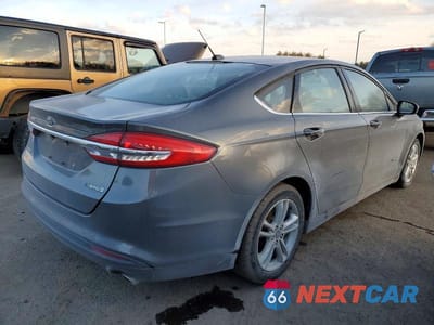 Trzecie zdjęcie samochodu z tyłu: 2018 FORD FUSION S HYBRID VIN:3FA6P0UU8JR142185 - miniatura