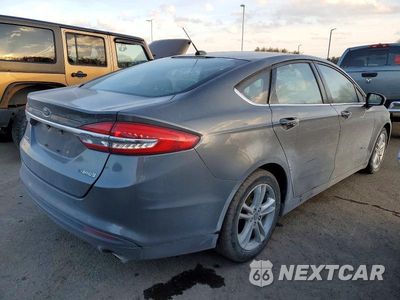 Trzecie zdjęcie samochodu z tyłu: 2018 FORD FUSION S HYBRID VIN:3FA6P0UU8JR142185 - miniatura