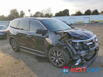 Czwarte zdjęcie samochodu z boku: 2019 HONDA PILOT TOURING VIN:5FNYF6H90KB059433 - miniatura