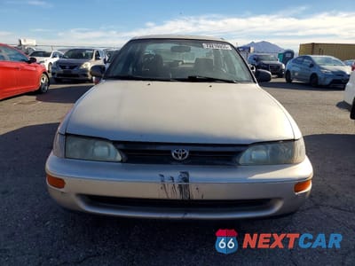 Piąte zdjęcie samochodu w środku: 1995 TOYOTA COROLLA VIN:1NXAE09B0SZ317343 - miniatura