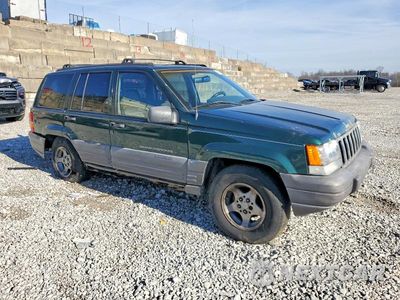 Czwarte zdjęcie samochodu z boku: 1998 JEEP GRAND CHEROKEE LAREDO VIN:1J4GZ58S0WC303207 - miniatura