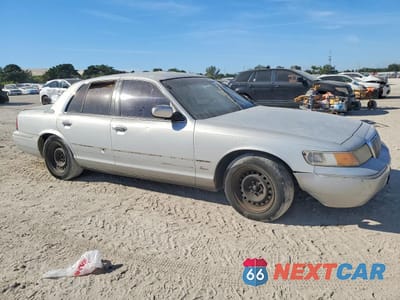 Czwarte zdjęcie samochodu z boku: 2002 MERCURY GRAND MARQUIS GS VIN:2MEFM74W12X609865 - miniatura