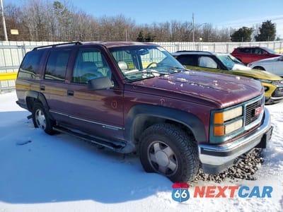 Czwarte zdjęcie samochodu z boku: 1999 CHEV TAHOE K1500 VIN:1GNEK13R3XJ365297 - miniatura