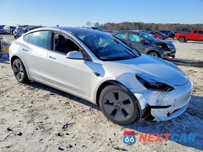 Czwarte zdjęcie samochodu z boku: 2023 TESLA MODEL 3 VIN:5YJ3E1EA5PF601311 - miniatura