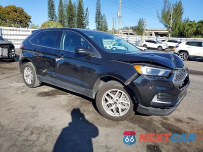 Czwarte zdjęcie samochodu z boku: 2023 FORD EDGE SEL VIN:2FMPK4J97PBA01115 - miniatura