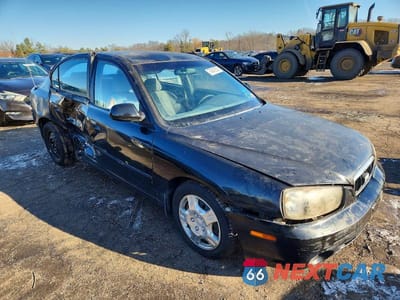 Czwarte zdjęcie samochodu z boku: 2003 HYUNDAI ELANTRA GLS VIN:KMHDN45D53U531094 - miniatura