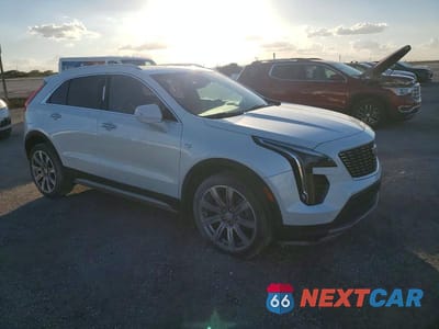 Czwarte zdjęcie samochodu z boku: 2019 CADILLAC XT4 PREMIUM LUXURY VIN:1GYFZCR48KF206877 - miniatura
