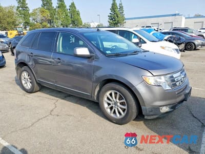 Czwarte zdjęcie samochodu z boku: 2010 FORD EDGE SEL VIN:2FMDK4JC0ABB59852 - miniatura