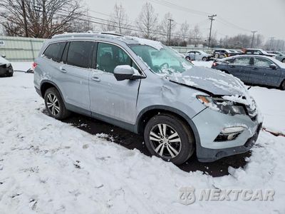 Czwarte zdjęcie samochodu z boku: 2018 HONDA PILOT EXLN VIN:5FNYF6H79JB021485 - miniatura