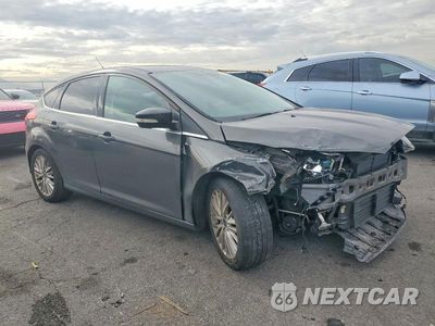 Czwarte zdjęcie samochodu z boku: 2016 FORD FOCUS TITANIUM VIN:1FADP3N2XGL374784 - miniatura