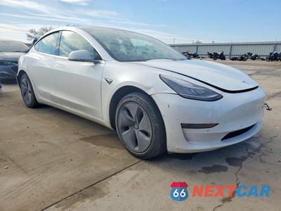 Czwarte zdjęcie samochodu z boku: 2019 TESLA MODEL 3 VIN:5YJ3E1EA1KF401681 - miniatura