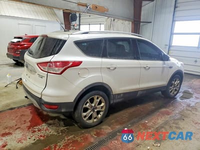 Trzecie zdjęcie samochodu z tyłu: 2016 FORD ESCAPE TITANIUM VIN:1FMCU9JX8GUA58471 - miniatura