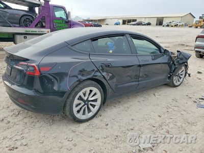 Trzecie zdjęcie samochodu z tyłu: 2023 TESLA MODEL 3 VIN:5YJ3E1EA7PF704634 - miniatura