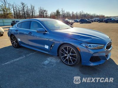 Czwarte zdjęcie samochodu z boku: 2021 BMW M850XI VIN:WBAGV8C04MCF86667 - miniatura