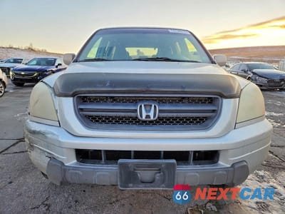 Piąte zdjęcie samochodu w środku: 2003 HONDA PILOT EXL VIN:2HKYF18573H527161 - miniatura
