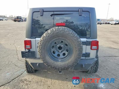 Zdjęcie 6 z 12 samochodu: 2014 JEEP WRANGLER UNLIMITED SAHARA VIN:1C4BJWEGXEL186926 - miniatura